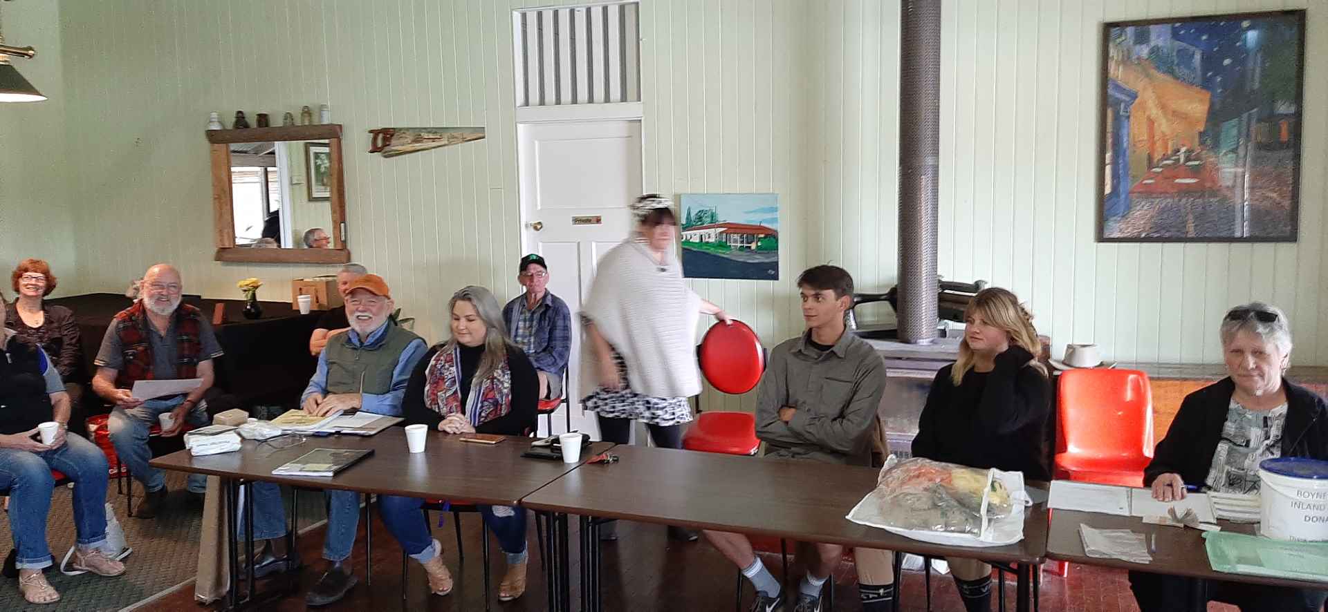 Members of Boyne Burnett Inland Rail Trail sitting, meeting Mungungo Pub